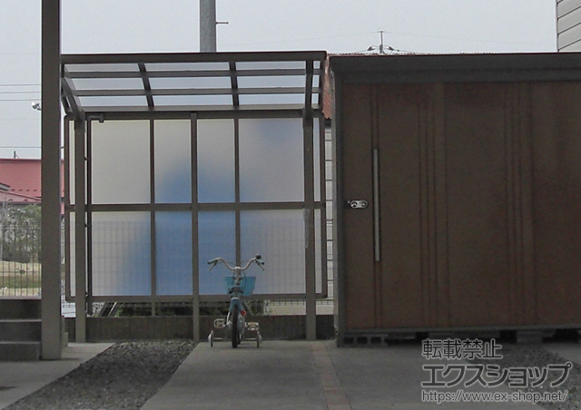 宮城県大崎市のLIXIL リクシル（トステム）のサイクルポート・駐輪場 カーブパークシグマIII パネル1面囲い 積雪〜30ｃｍ対応 施工例