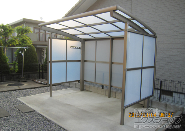 大分県宇佐市のLIXIL リクシル（トステム）のカーポート カーブパークシグマIII パネル3面囲い 積雪〜30cm対応 施工例