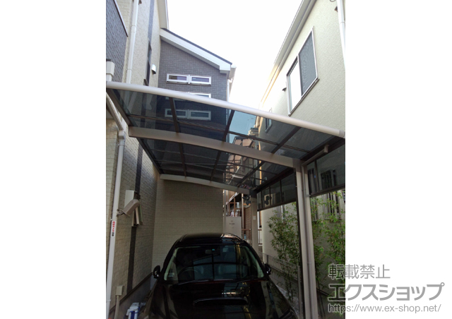 東京都江戸川区のLIXIL リクシル（トステム）のカーポート カーブポートシグマIII 積雪〜20cm対応＋吊り下げ物干し　標準 2本入 施工例