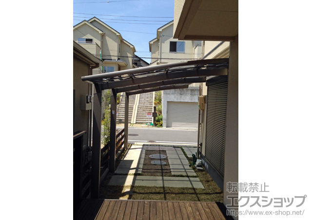 大阪府枚方市のLIXIL リクシル（トステム）のカーポート カーブポートシグマIII 延長 積雪〜20cm対応 施工例