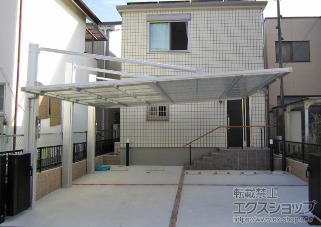 愛知県名古屋市の三協アルミカーポート施工例(ダブルフェース 積雪〜20cm対応＋サポートセット＋アルミたて樋セッ＋竿掛けセット＋偏芯基礎部品セット :21410923-1)