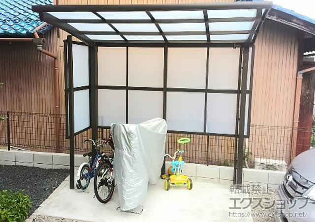 滋賀県愛知郡愛荘町のLIXIL リクシル（トステム）のサイクルポート・駐輪場 カーブパークシグマIII 2面囲い 積雪〜20cm対応 施工例