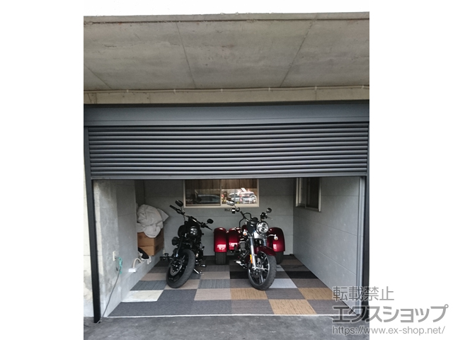 大阪府泉南郡熊取町のLIXIL リクシル（トステム）のガレージシャッター ガレージシャッタークワトロ 電動式 外部付タイプ 施工例