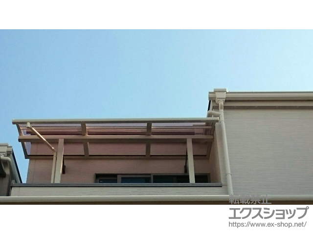 大阪府大阪市ののバルコニー・ベランダ屋根 スピーネ R型 屋根タイプ 単体 積雪〜20cm対応＋壁付け物干し 施工例