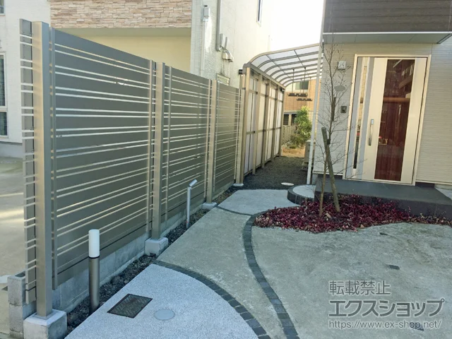 京都府舞鶴市のLIXIL(リクシル)のテラス屋根 スピーネストックヤードR型 パネルタイプ スクリーン仕様 1500タイプ 積雪～50cm対応 施工例
