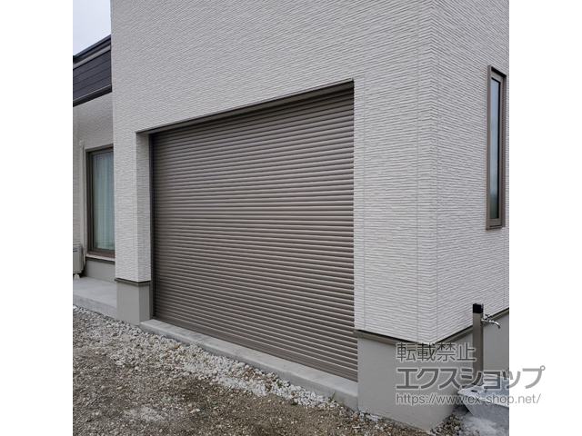 宮城県名取市のLIXIL リクシル（トステム）のガレージシャッター ガレージシャッタークワトロ 電動式 内部付タイプ 施工例
