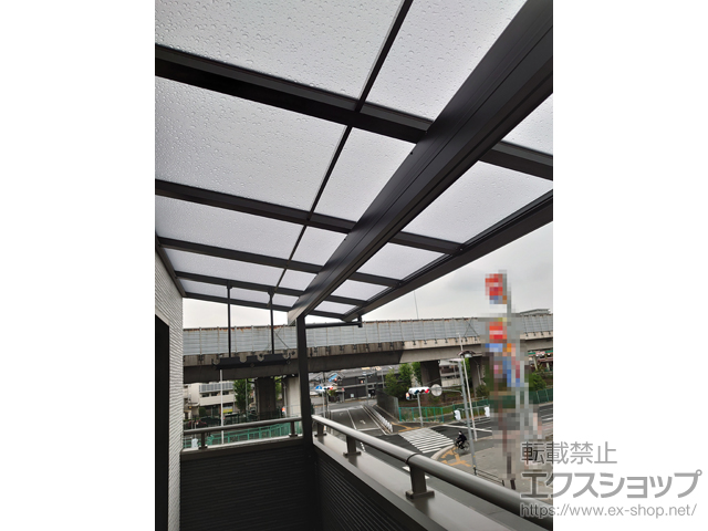 大阪府大阪市のLIXIL リクシル（トステム）のバルコニー・ベランダ屋根 パワーアルファ F型 屋根タイプ 単体 積雪〜30cm対応 施工例
