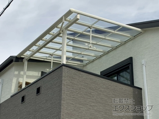 大阪府大阪市のLIXIL リクシル（トステム）のバルコニー・ベランダ屋根 パワーアルファ F型 屋根タイプ 単体 積雪〜30cm対応 施工例